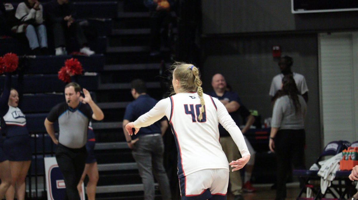 Sophia Loden, guard/forward, retreats on defense after draining a three-pointer against Southern Illinois University Edwardsville Saturday, Jan. 31, at Liberty Arena. (Photo by Anderson Schmidt)