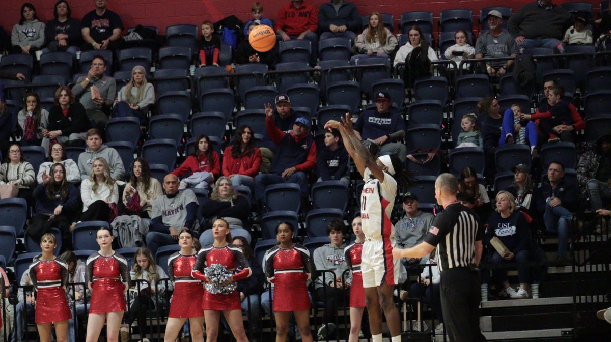 Sheridan Sharp, junior guard, shoots an uncontested three-pointer against Southern Illinois University Edwardsville Saturday, Jan. 31, at Liberty Arena. (Photo by Anderson Schmidt)
