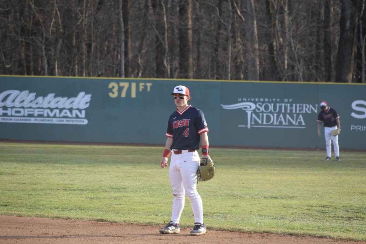 Patrick McLellan, senior outfielder playing first base, prepares for a pitch against Illinois State University Tuesday, March 3, at USI Baseball Field. (Photo by Anderson Schmidt)