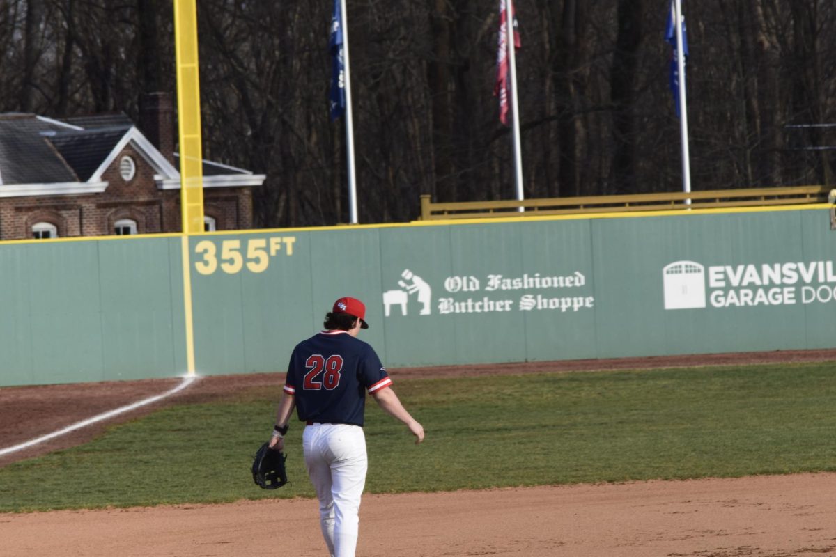 Parker Martin, junior infielder, walks back to his position at third base during the game against Illinois State University Tuesday, March 3, at USI Baseball Field. (Photo by Anderson Schmidt)
