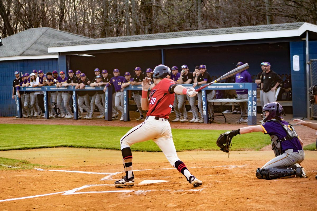 Micajah Wall, senior catcher/designated hitter, puts a ball into play against Western Illinois University Friday, March 20 at USI Baseball Field. (Photo by Amber Adams)