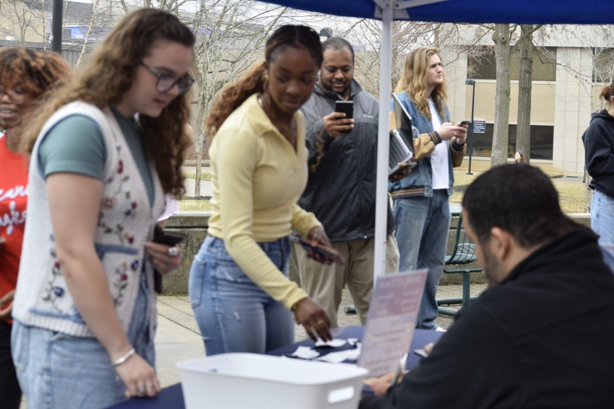 Mallory Friend, sophomore political science and sociology major, and Leonna Benton, senior political science and pre-law major, use their student IDs to get tickets to the 2026 SpringFest concert Wednesday, March 4, at the Rice Plaza. (Photo by Cade Smithson)