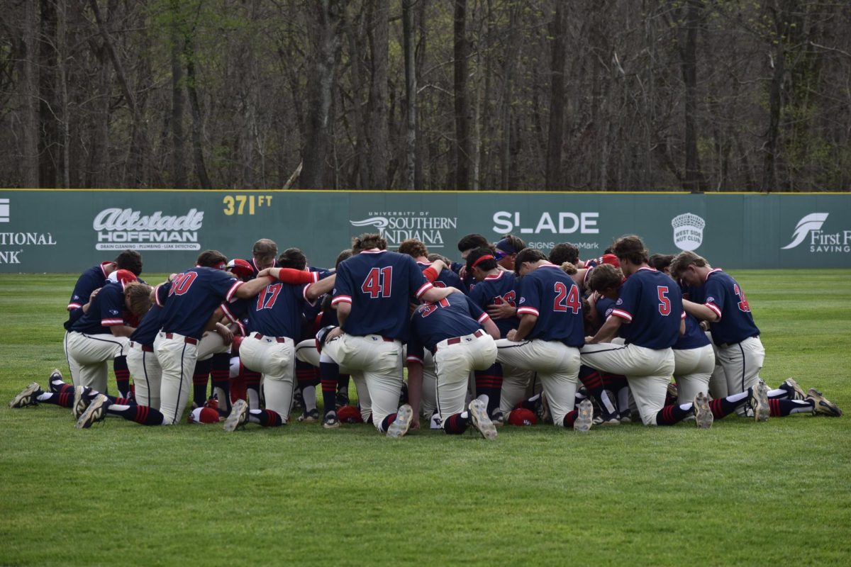 The USI Baseball team huddles before the game against Southern Illinois University Edwardsville Thursday, April 2, at USI Baseball Field. 