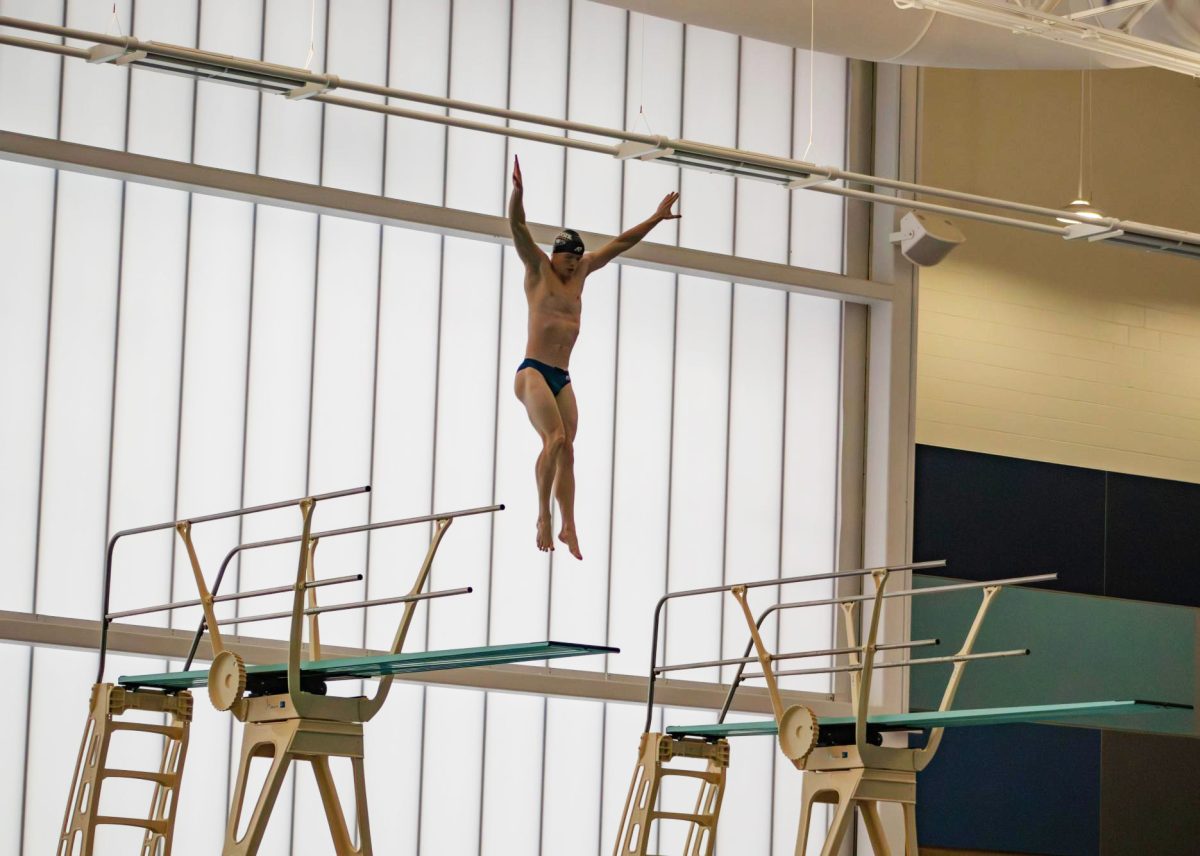 [FILE] Nathan Deputy, junior diver, hurdles in the air during a five-meter dive at the 2025 Evansville Regional Sports Commission Diving Invitational Tuesday, Dec. 16, 2025, in the Deaconess Aquatic Center. (Photo by Amber Adams)