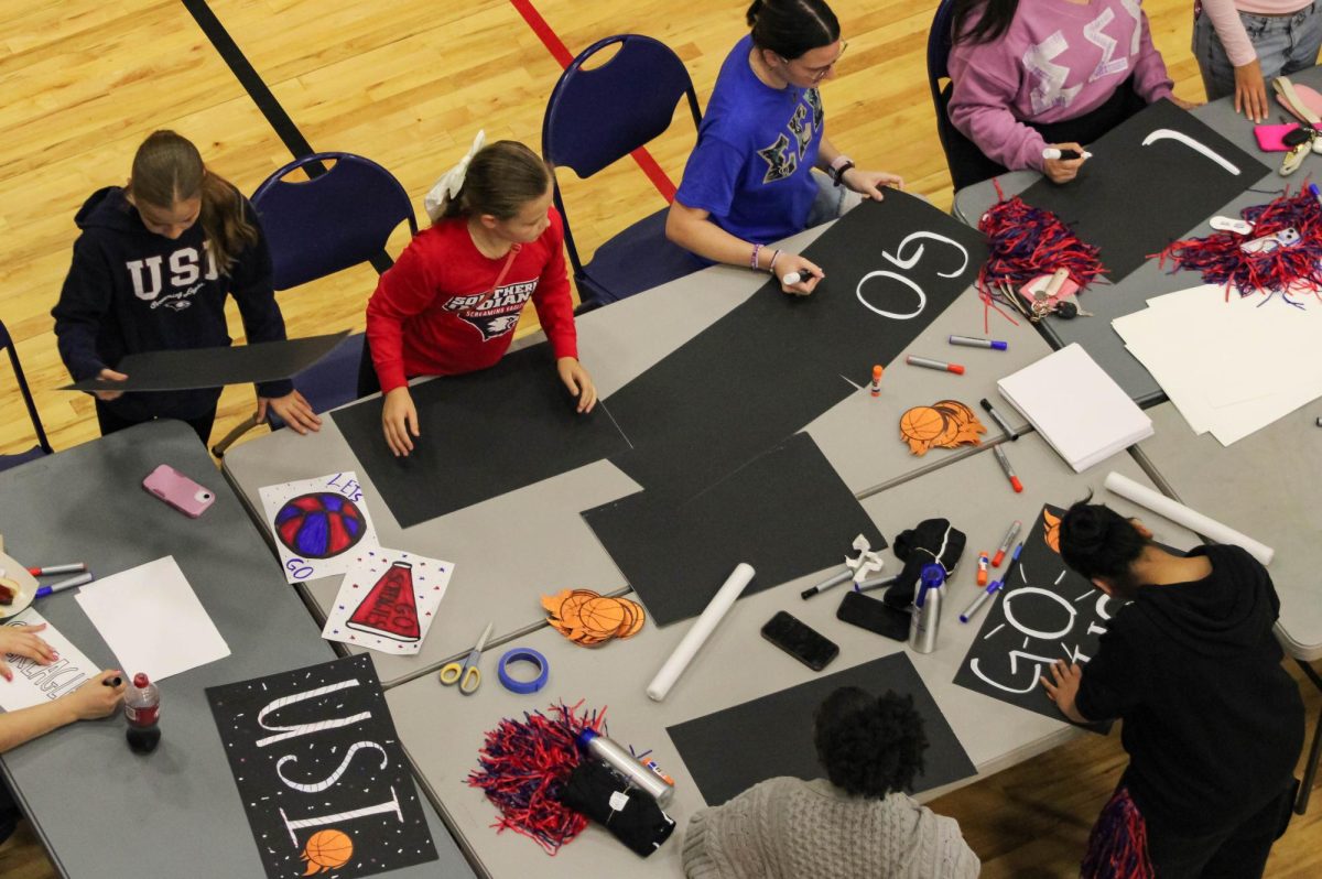 [FILE] Students decorate USI-themed basketball signs at the First Friday Tailgate before a doubleheader of women's and men's basketball games Friday, Nov. 7, 2025 in Screaming Eagles Complex. (Photo by Izzy Hannon)