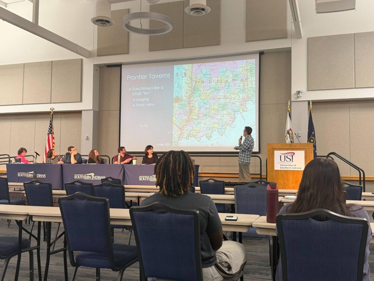 Speaker gives an academic presentation on taverns in New Harmony that connects to the theme of fear at the 18th Annual Interdisciplinary Colloquium Tuesday, April 14, in Carter Hall. (Photo by MJ Clark)
