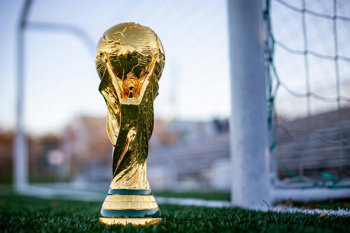 A FIFA World Cup replica trophy lies in front of a goal Wednesday November 17, 2021 in the United Kingdom. (Photo courtesy of My Profit Tutor) 