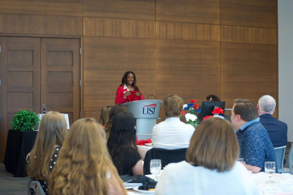 Leonna Benton, president of the Student Government Association, looks at the crowd at the SGA banquet, senior recognition and inauguration during her last speech as president Thursday, April 23, in the Griffin Center. 