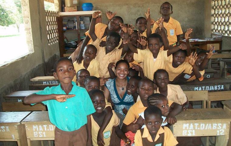 Brandi Neal poses with a group of Ghandaian students on her first trip to Ghana/Photo courtesy of Neal