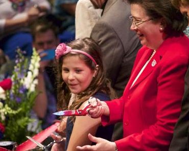 USI president, Dr. Linda Bennett, cuts the ribbon with LillyBea Ireland at the Performance Center