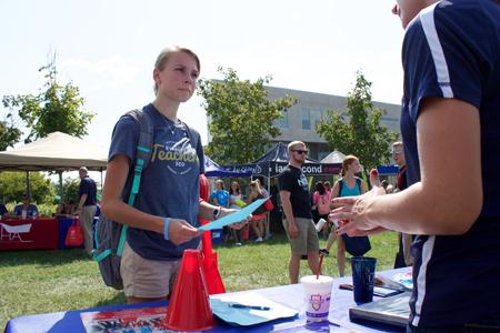 Jessica Elward joins the student ambassador club during the involvement fair.