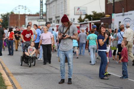 Greg Niemeier spends his Fall Festival camera in hand to capture moments such as these of those enjoying the many food options the festival has to offer. 
