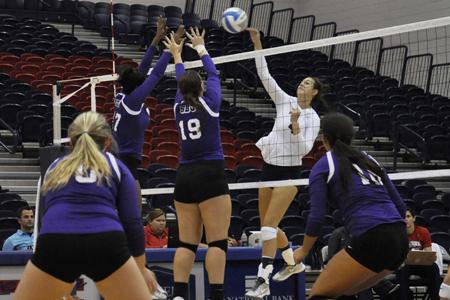 Middle block senior Abbey Winter spikes the ball to try to score against Southwest Baptist University.