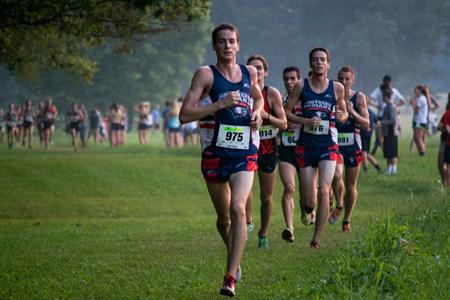 Johnnie Guy, a senior engineering major, leads the pack during the Stegemoller Classic in which the men’s cross country team finished first at the beginning of the season. Their success this year led to coach Hillyard being named coach of the year