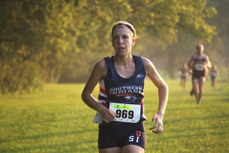 Sophomore Emily Roberts runs during the Stegemoller Classic held at the Angel Mounds State Park in Evansville. Roberts won the classic by five seconds and the women’s cross country team finished second overall. 
