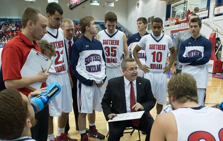 Head coach Rodney Watson lays out the game plan to members of the 2014-15 men’s basketball team during a game agaisnt Davis Elkins College. Watson is the ninth head coach for the men’s team and 2015-16 will be his seventh coaching season. 