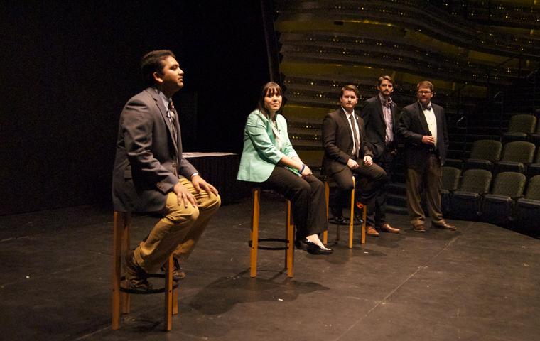 SGA presidential candidates Nehal Ninad, Alexa Bueltel, Alex Hoffmann present their platforms Friday at the USI Performance Center. SGA President Zack Mathis and Chief Justic Jason Minor moderated the event (From left to right). Photo by Alyssa Smith/The Shield